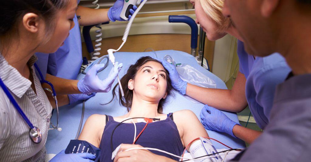 40030 A team of doctors and nurses collaborates to provide care for a patient
